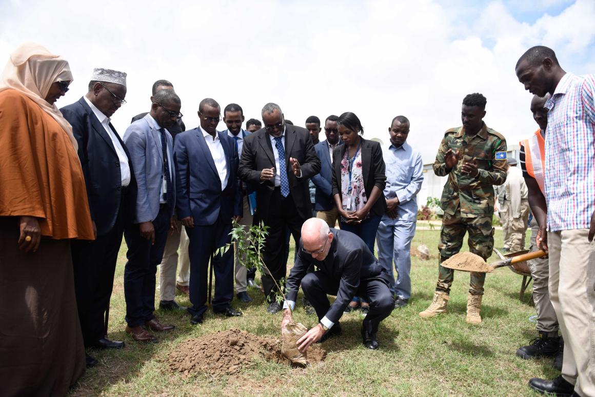 The UN envoy to Somalia, James Swan, plants a commemorative tree at the UN compound in Jowhar, HirShabelle State, Somalia, on 17 July 2019. UN Photo / Raymond Baguma